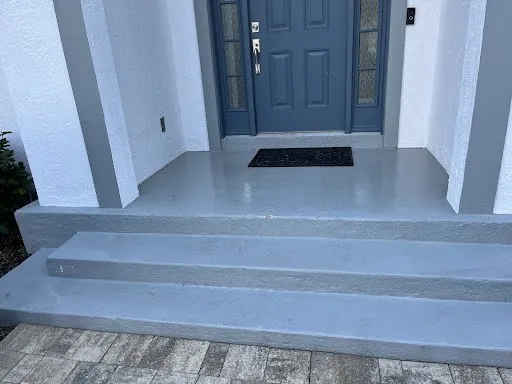 Front entry steps and stucco walls after a house wash